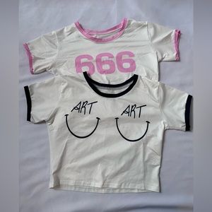 Two graphic baby tees